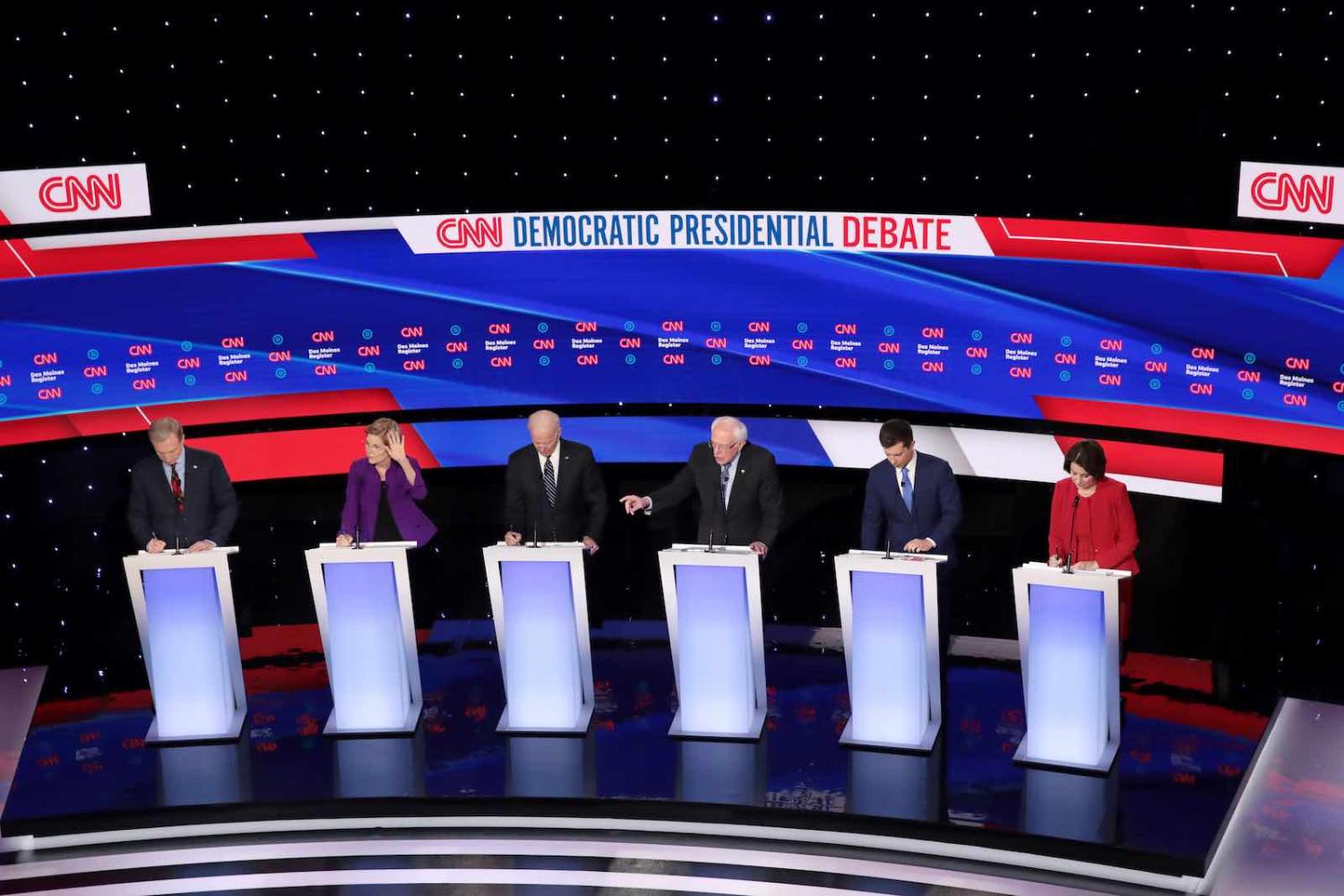 Democratic presidential candidates on the debate stage at Drake University in Des Moines, Iowa, 14 January (Photo: Scott Olson/Getty Images)